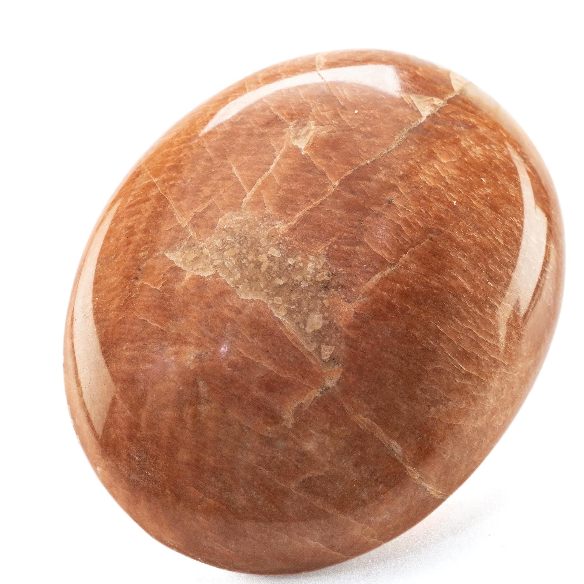 Kalifano Sunstone Melocotón en palma, calma emocional y enfoque.
