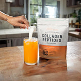 Live Conscious Collagen Peptides Durazno Mango en etiqueta, fácil identificación de sabor.