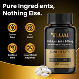 LUAL Calcio Minis 600 mg con D3, cápsulas dentro del vaso.