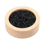 Difusor Lusofie con base-madera y roca-lava, ideal para aromatizar el escritorio.