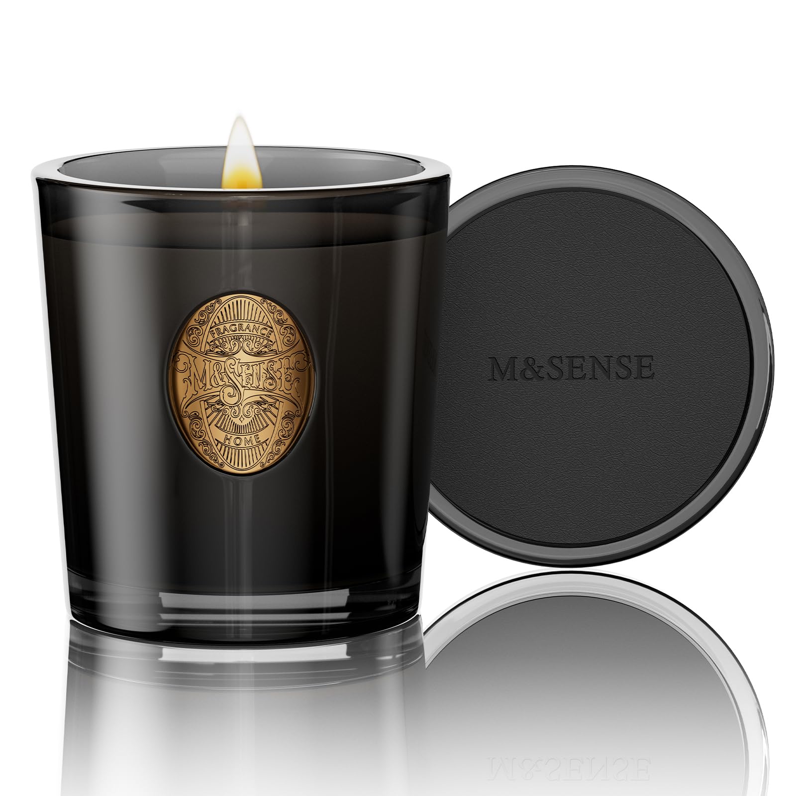 Vela M&SENSE de soya en vaso negro para crear un ambiente relajante.