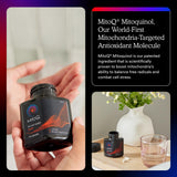 MitoQ Pure bottle on the counter with a glass of water