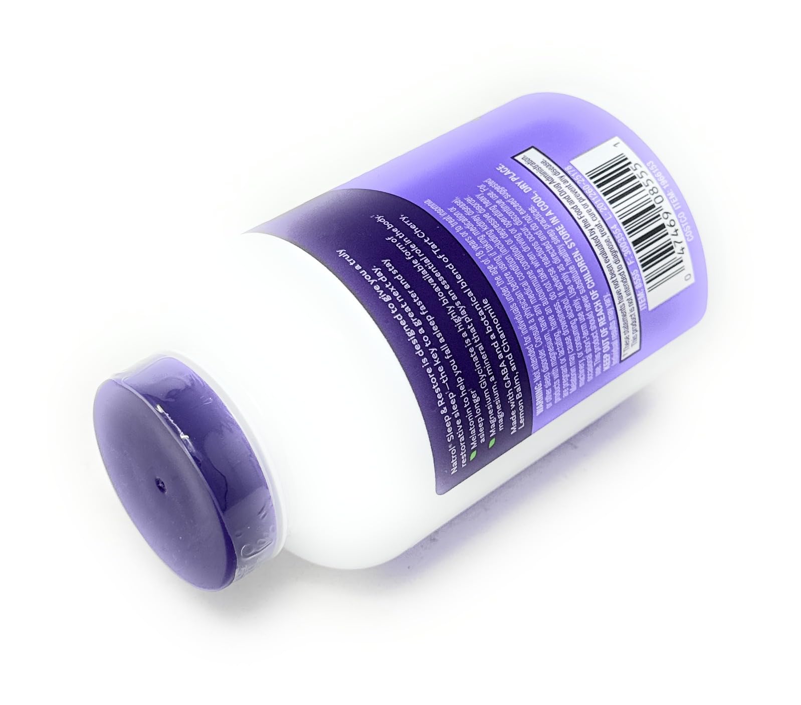 Natrol Descanso y Restauración, caja del producto sobre mesa.