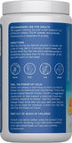 Natural Vitality CALM: vaso con bebida naranja lista para relajación.