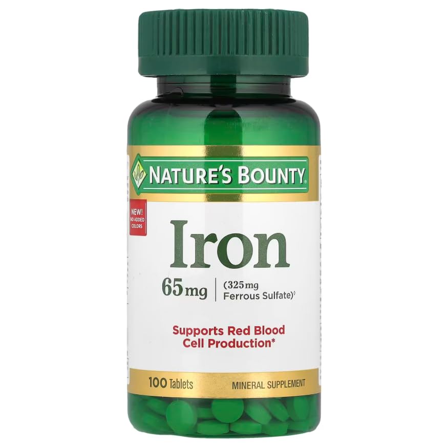 Nature's Bounty Hierro 65 mg, tableta en mano, dosis diaria conveniente.
