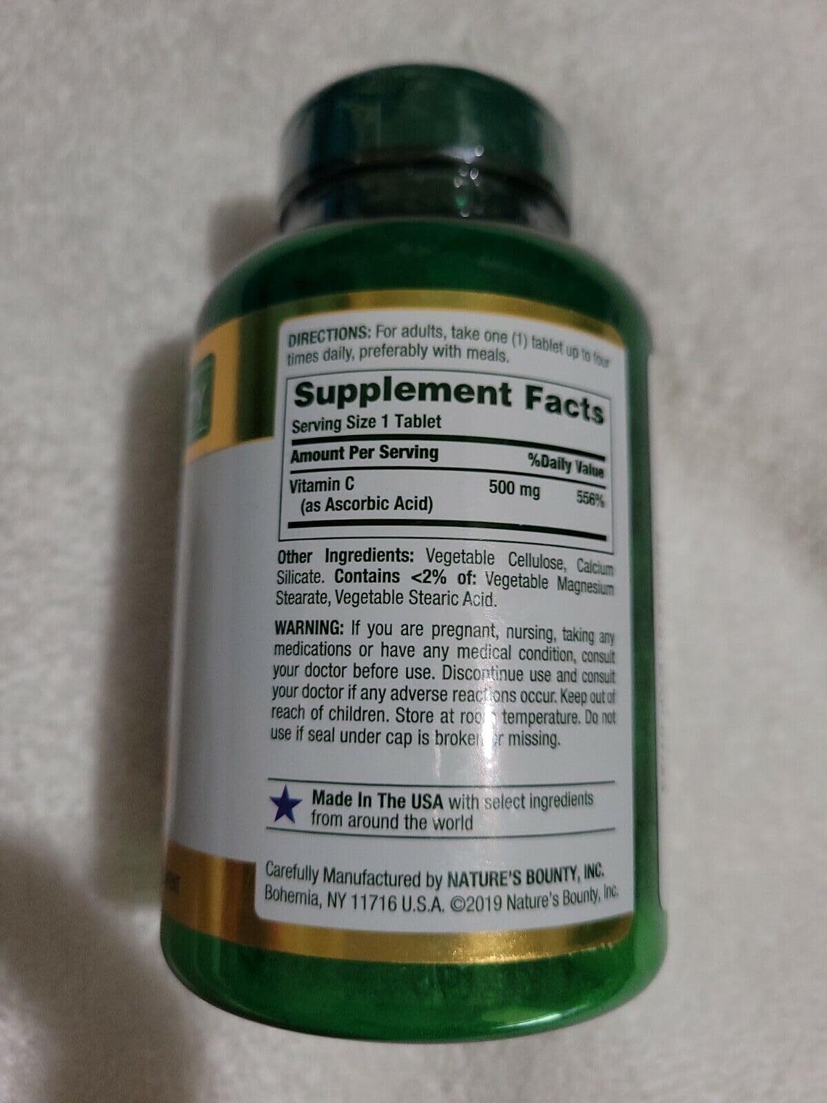 Nature's Bounty Vitamina C 500 mg, detalle de tableta, soporte inmunológico potencial