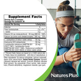 Pastillas en mano con NaturesPlus Dental Care Probiotic para uso diario.