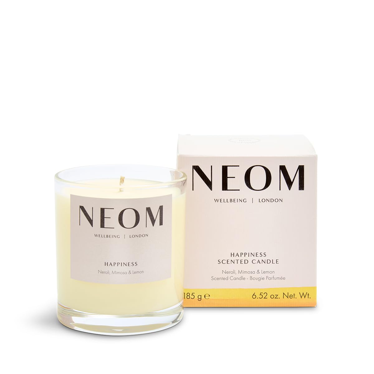 Vela NEOM Happiness de una mecha iluminando el salón con aroma calmante