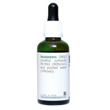 Etiqueta legible de NEW ROOTS HERBAL en frasco de DMSO con display claro.