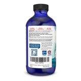 Nordic Naturals DHA infantil, niño con sorbo, sabor naranja que facilita consumo.