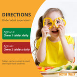 NuBest Doctor Taller Kids: niño sonriendo mientras toma una tableta masticable, sabor uva.