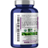 Mano sosteniendo cápsulas de Tulsi NusaPure para consumo diario