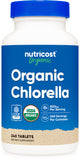 Frasco de Nutricost Chlorella Orgánica 500 mg con 240 tabletas para consumo diario.