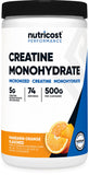 Nutricost Creatina Monohidrato en polvo dentro de un bote, ideal para entrenamientos.