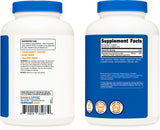 Nutricost Magnesium Complex 500mg: cápsulas con vaso de agua sugiriendo ingesta.