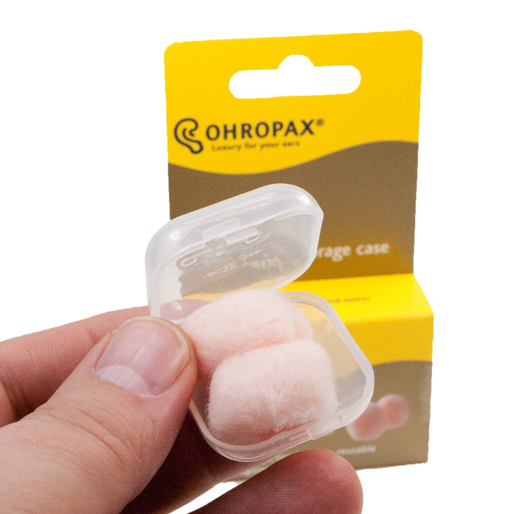 Estuche transparente OHROPAX para transporte práctico de tapones y orden.