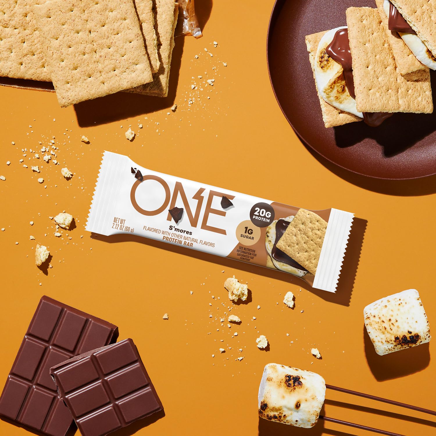 Barra ONE proteina sabor s'mores con galleta graham, snack portátil.