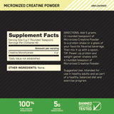 Cucharita medidora junto al envase de creatina Optimum Nutrition micronizada, para dosis precisa.