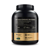 Optimum Nutrition Gold Standard Pro Gainer - color crema vainilla visible en taza.