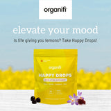 Color amarillo de Organifi Happy Drops gomitas y sabor cítrico para mejorar el estado de ánimo.