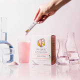 PIQUE BT Fountain Beauty powder dissolving in water, ready for use.