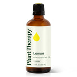 Aceite Plant Therapy de limón en botella de 100 ml vertido.
