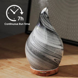 Base de madera con difusor Porseme y vidrio decorativo.