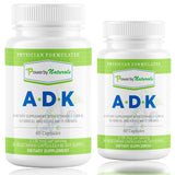 Power By Naturals ADK envase sobre mesa, opción clara de suplemento vitamínico.