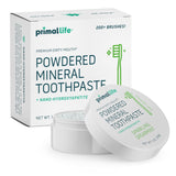 Polvo dental Primal Life Organics para boca limpia tras el cepillado.