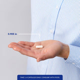 Pure Encapsulations Magnesio glicinato, manos sosteniendo cápsulas para consumo