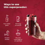 PureHealth Reds Superfoods: vaso con agua, textura suave y sabor afrutado.
