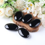 QINJIEJIE obsidiana negra palmar: regalo versátil para meditación y decoración de escritorio.