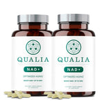 Qualia NAD, botella en escena, apoyo a la energía diaria y bienestar.