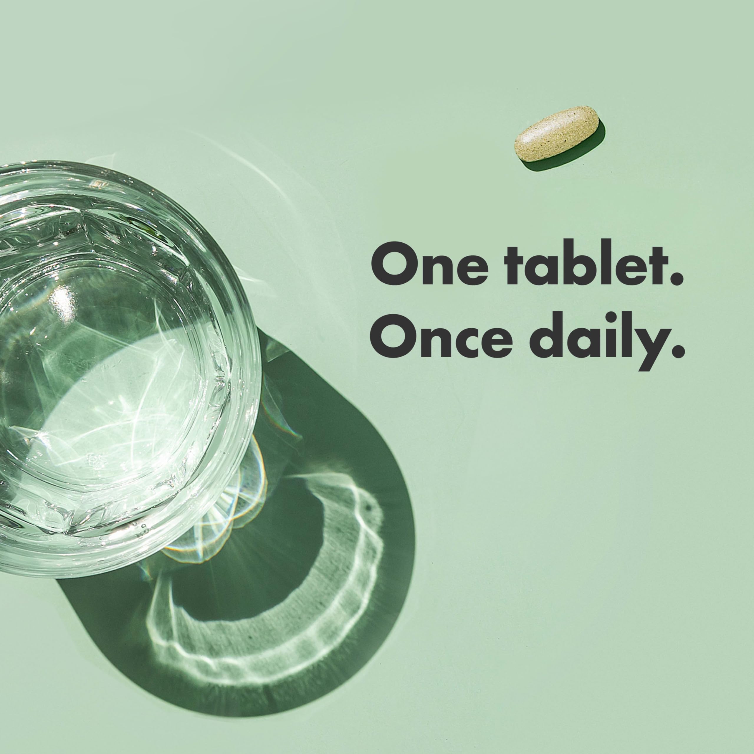 Rainbow Light Multivitamin Women’s One, envase abierto mostrando el polvo dentro.