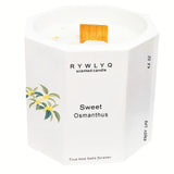 Vela RYWLYQ Osmanthus en cerámica blanca octogonal, ideal para relajación y ambiente.