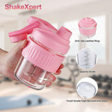 ShakeXpert botella de vidrio ergonómica con mango para transporte cómodo.