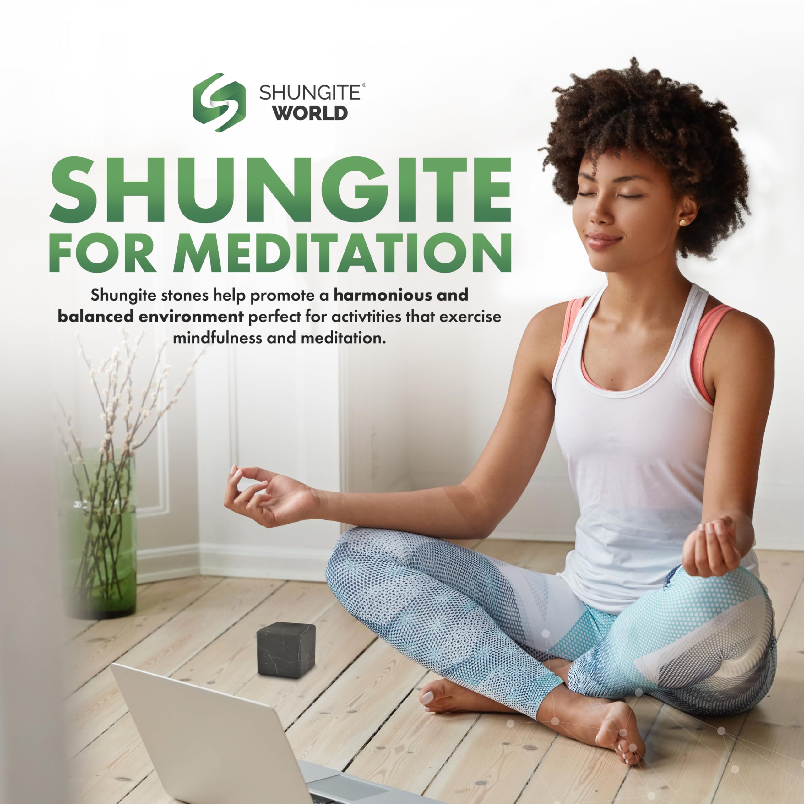 Cubo Shungite World junto a dispositivos para protección cercana.