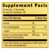 Spring Valley gominas Vitamina C 240 mg, envase abierto mostrando la textura naranja.