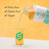 Vaso con Symprove Mango y Passionfruit, bebida no láctea apta para dietas diversas.