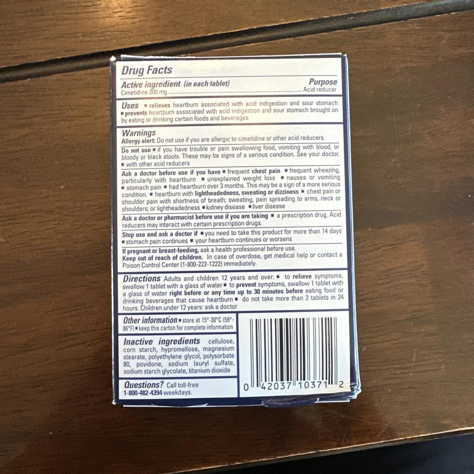 Botella Tagamet HB 200 mg, uso en viaje para alivio rápido.