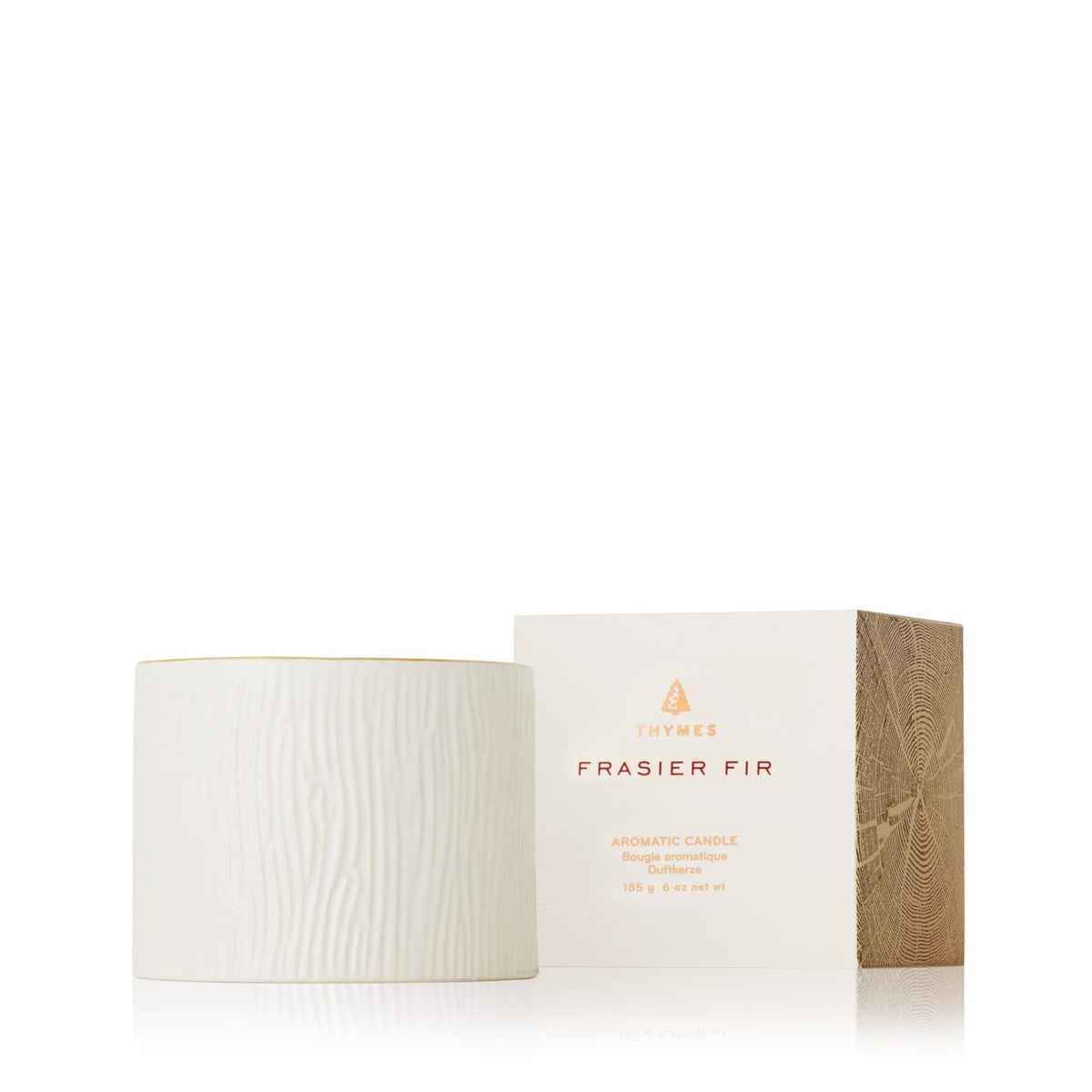 Vela Thymes Frasier Fir en cerámica con vetas de madera para ambiente cálido y elegante.