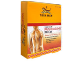 Parche Tiger Balm aplicado en la zona dolorida para alivio localizado.