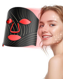 Máscara tinkoola con luz roja en el rostro para uso facial en casa.