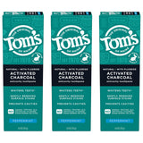 Tom's of Maine caja de tres tubos en ambiente de baño.