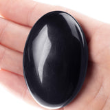 Superficie pulida de obsidiana negra de UFEEL para un agarre cómodo.