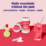 Scoop dispensing Ultima Replenisher electrolytes into water for easy mixing