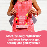 Vaso con agua y stickpack Ultima Replenisher para hidratación rápida