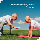 Persona sosteniendo el frasco de UpNourish Magnesio Citrato para defensa contra calambres