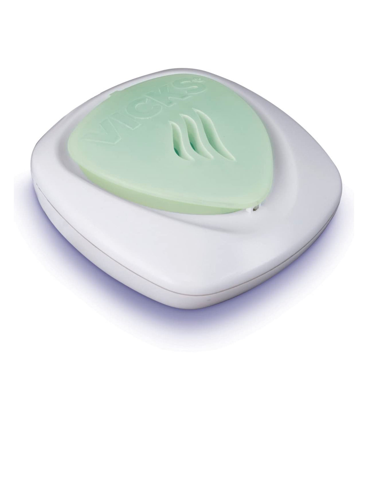 Vicks vaporizador sin agua para adultos, compacto en la mesa de noche.