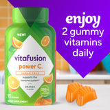 Gomitas de color naranja Vitafusion Power C, sabor refrescante para la rutina diaria.